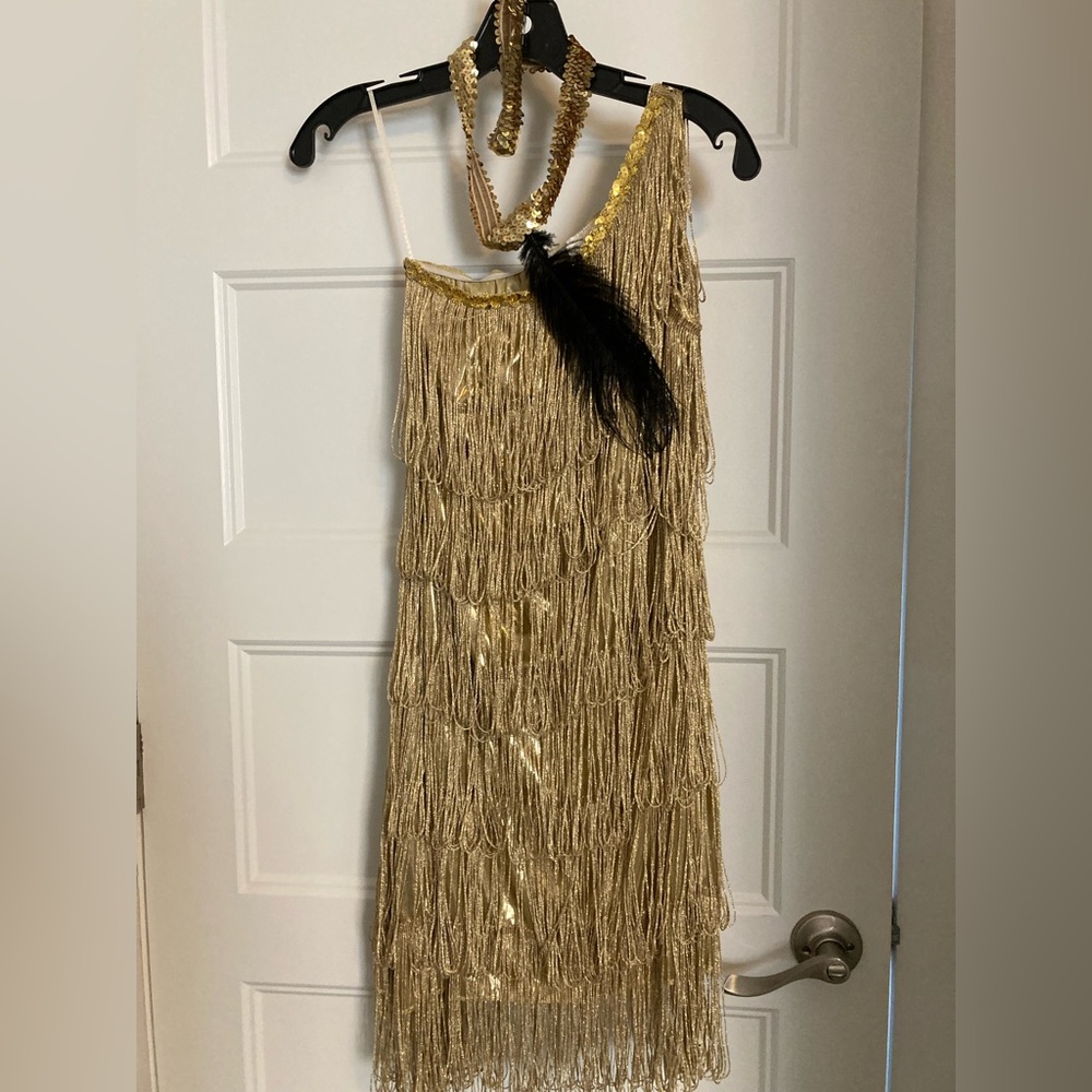 Off shoulder gold fringe party dress.